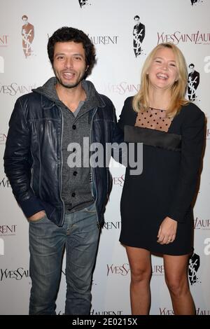Mabrouk El Mechri und Virginie Efira bei der Premiere des Films Yves Saint Laurent im Kino UGC Normandie in Paris, Frankreich am 19. Dezember 2013 in Paris, Frankreich. Foto von Nicolas Briquet/ABACAPRESS.COM Stockfoto