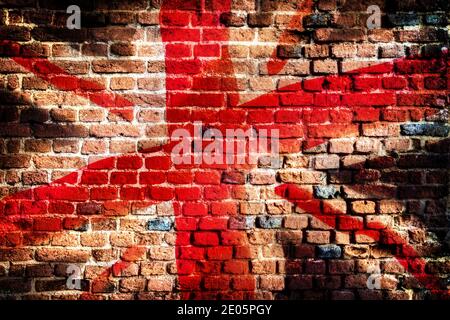 Union Jack Flagge Graffiti auf einem alten Backsteinmauer Grunge Hintergrund Stockfoto