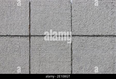 Wandplattengehäuse aus Beton. Struktur der Betonplatten. Abstrakter Hintergrund. Stockfoto