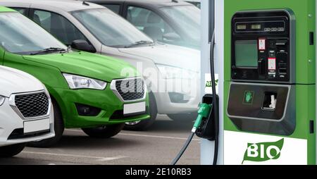 Biokraftstofftankstelle auf dem Hintergrund von Autos. Ein Auto grün. Stockfoto