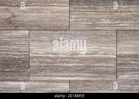 Hintergrund von einer Wand aus braunen Granitplatten Stockfoto