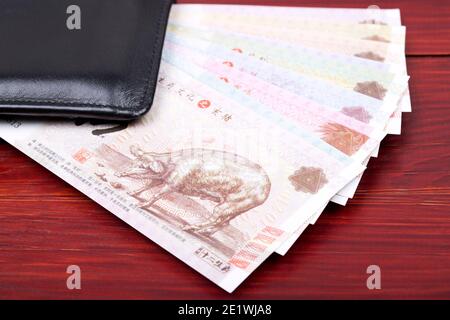 Chinesisches Geld in der schwarzen Brieftasche Stockfoto