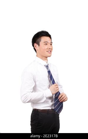 Junge Business Mann Anpassung Krawatte im Zimmer hohe Qualität Foto Stockfoto