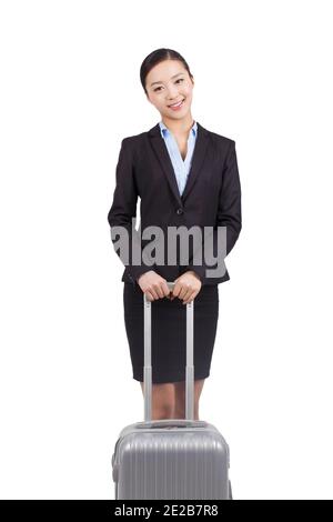 Eine junge Geschäftsfrau zu Fuß mit Koffer hochwertige Foto Stockfoto