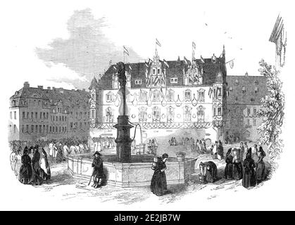 Das Regierungsgebäude, Coburg, 1845. Frauen sammeln Wasser in Eimern von einer Pumpe auf dem Coburger Platz in Deutschland. Aus "Illustrated London News", 1845, Vol VII. Stockfoto