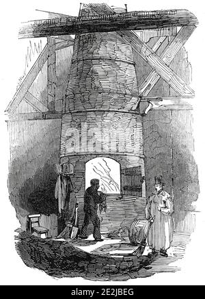 The Kiln, London Docks, 1845. 'In der Nähe der Nord-Ost-Comer der Lagerhäuser ist eine Tür eingeschrieben ", um den Ofen," wo beschädigte Tabak verbrannt wird; die lange Rohr, die den Rauch abträgt, wird scherzhaft als "The Queen's Pipe." In diesem Ofen werden alle Waren verbrannt, die nicht die Menge ihrer Zölle und Zollgebühren abholen; und hier wurden Tabak, Seide, Satine, Tee, Rindfleisch, Schweinefleisch und 45,000 Paar Handschuhe konsumiert - letztere bei einer Verbrennung!' Aus "Illustrated London News", 1845, Vol VII. Stockfoto