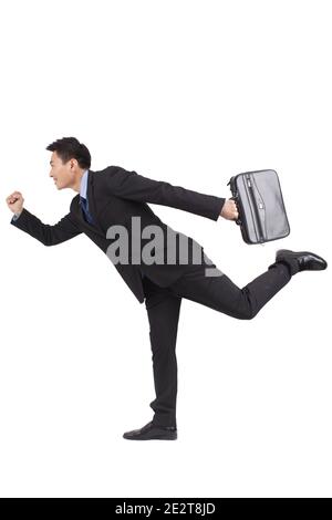 Portrait des jungen Geschäftsmannes mit Aktentasche und läuft hohe Qualität Foto Stockfoto