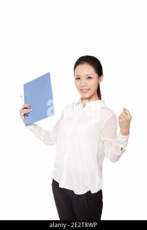 Die stehende Geschäftsfrau mit ihrem Stift hochwertige Foto Stockfoto