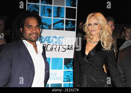 Adriana und Christian Karembeu bei der Trace Sport TV Party während der MIPTV 2010 in Cannes, Frankreich am 12. April 2010. Foto von Giancarlo Gorassini/ABACAPRESS.COM Stockfoto