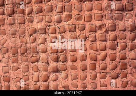 Closeup shot of a mosaic wall made of cement Stockfoto