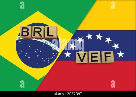 Brasilien und Venezuela Währungen Codes auf nationalen Flaggen Hintergrund. Internationales Geldtransferkonzept Stockfoto