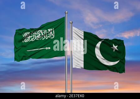 Saudi-Arabien und Pakistan, zwei Fahnen winken gegen blauen Himmel. 3d-Bild Stockfoto