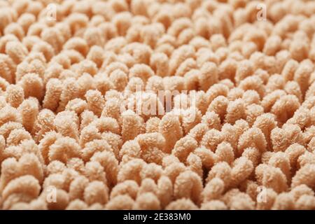 Die Struktur der beigen Wollfasern im Vollbildmodus als Hintergrund. Nahaufnahme Stockfoto