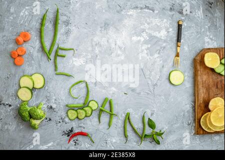 Gemüse Vegan Wort auf Grunge abstrakten Hintergrund Stockfoto