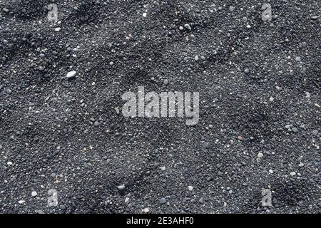 Schwarzer Sandstrand als Hintergrund Stockfoto