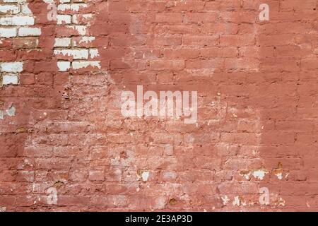 Vollrahmen abstrakten Hintergrund einer antiken rosa Farbe gemalt Ziegelwand Textur mit einem Shabby Chic künstlerisch aussehen aus Ungleichmäßige Verschlechterung Stockfoto