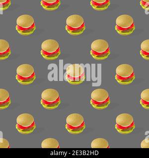 Fast Food. Nahtloses Muster aus Kunststoff Kinder Spielzeug Burger mit Salat, Tomaten, Fleisch auf grauem Hintergrund. Nicht nützlich Stockfoto