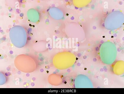 Festliche Ostern Komposition. Bunte Pastelleier und Konfetti auf rosa Hintergrund. Frohe Ostern Grußkarte. Stockfoto