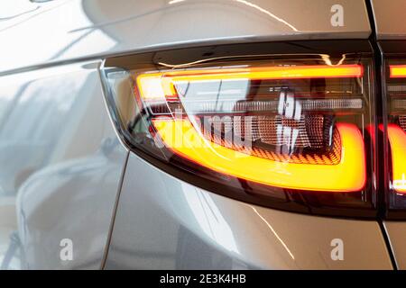 Closeup photograph of back part of modern silver car. Selective focus Stockfoto