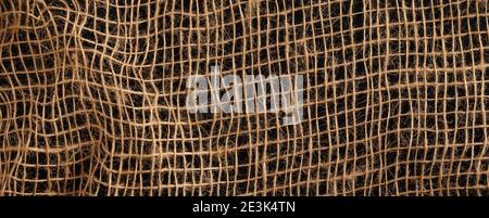 Hessischer Sacktuch gewebte Textur Hintergrund in beige Farbe Stockfoto