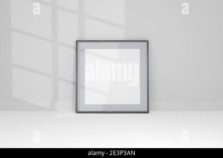 3d Mockup schwarz Rahmen Foto an der Wand mit Schatten. Stockfoto