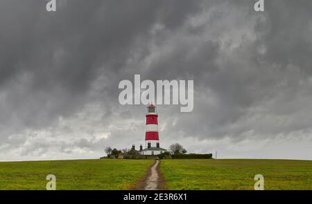 Happisburgh Leuchtturm und Stormy Sky North Norfolk nur unabhängig betrieben Leuchtturm in Großbritannien Stockfoto