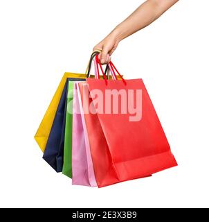 Eine Frau Hand trägt ein Bündel von Einkaufstaschen isoliert Auf Weiß Stockfoto
