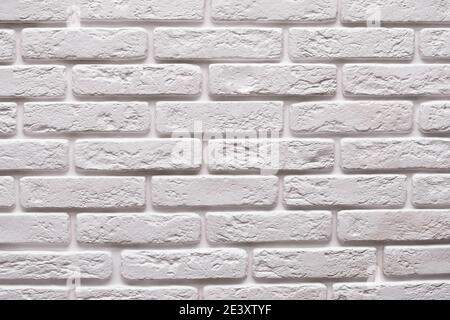 Moderne weiße Backsteinwand Textur für Hintergrund mit Kopierraum. Stockfoto