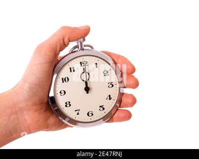 Vintage-Stil Uhr zur Hand, um die Zeit zu überprüfen. Konzept für die Verwaltung von Zeit, Fristen, Pünktlichkeit, pünktliche Lieferung, Schnelligkeit und Terminvereinbarung. Stockfoto