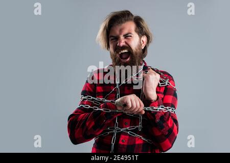 Leidend Mann angekettet fühlen Krämpfe und Muskelkrämpfe, versuchen, sich zu befreien. Stockfoto