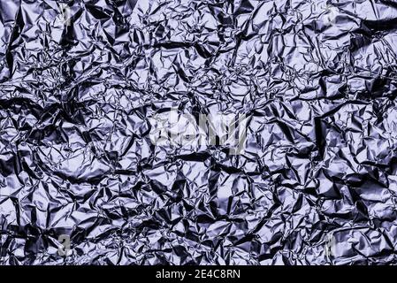 Graphitfolie Hintergrund mit glänzend zerknitterte Oberfläche für Textur Hintergrund. Schillernde Oberfläche zerknittert Folie. Stockfoto