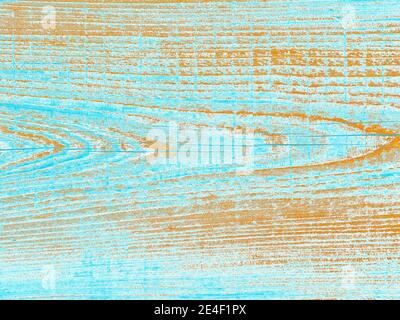Verwittertes Brett in Blau und Orange - Nahaufnahme der Seite eines alten Nebenhauses, digital manipuliert, um mehr Blau und Orange/Tan Farbe hinzuzufügen. Stockfoto