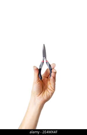Zange zur Reparatur in den Händen eines männlichen Isolats. Selektiver Fokus. Menschen. Stockfoto