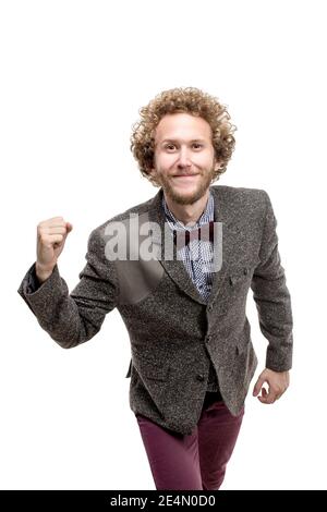 Bärtig glücklich lächelnden Geschäftsmann freut sich über seinen Erfolg. Stockfoto