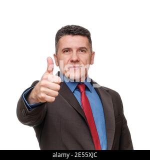 Portrait schöner Mann trägt Anzug und blaues Hemd zeigt Daumen Nach oben Stockfoto
