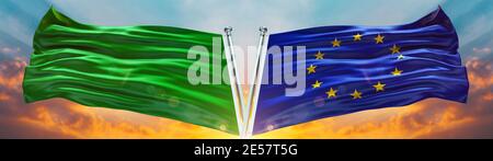 Flagge der Europäischen Union und alte Libyenflagge winken mit Textur Himmel Wolke und Sonnenuntergang Doppelte Flagge Stockfoto