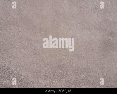 Wand mit beige rosa körnigen Putz. Textur nicht nahtlos. Stockfoto