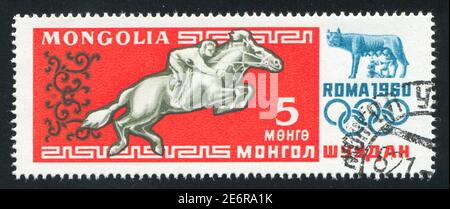MONGOLEI - UM 1960: Briefmarke gedruckt von der Mongolei, zeigt Wettbewerb, um 1960 Stockfoto