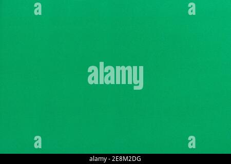 Nahaufnahme gefleckten grünen Papier Hintergrund und Textur. Grünes Papier mit Papierstreifen. Stockfoto