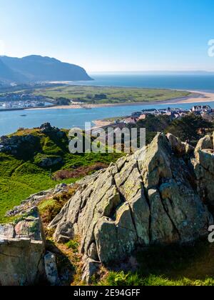 View looking down over Deganwy and the mouth of the River Conwy in Conwy North Wales from the ruins of Deganwy Castle with rocks in foreground. Stockfoto