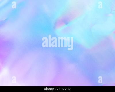 Schöne holografische Regenbogen abstrakten Hintergrund in Pastell-und Neon-Farbdesign. Echte Fotografie Schuss von holographischen Folie für kreative Projekt - Design Mode, Cover, Buch, Druck. Speicherplatz kopieren Stockfoto