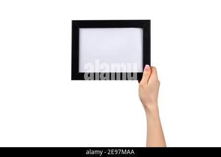 Weibliche Hände halten Fotorahmen isoliert auf weiß Stockfoto