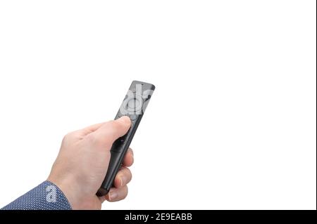 Online-Mediensteuerung. Mann Hand mit moderner Fernbedienung isoliert auf weißem Hintergrund. Fernbedienung aus einer Online-Media-Box in der Hand eines Mannes. Ziffer Stockfoto