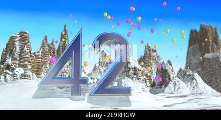 Nummer 42 in dickem blauem Font auf einem verschneiten Berg mit Felsgebirgslandschaft mit Schnee und roten, gelben und lila Luftballons im Hintergrund. Stockfoto