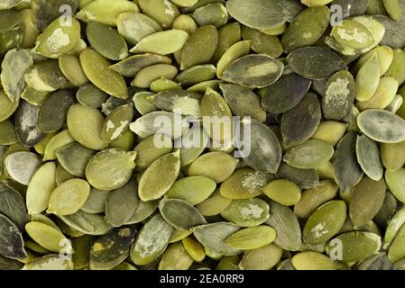 Kürbiskerne Hintergrund. Grüne Pepita Samen. Draufsicht. Stockfoto
