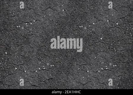 Asphaltstruktur - Draufsicht und Nahaufnahme eines Fragments Der asphaltierten Straße Stockfoto