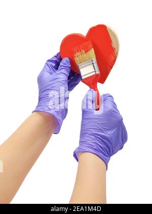 Die Hand malt das Herz mit einem Pinsel Stockfoto