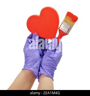 Die Hand malt das Herz mit einem Pinsel Stockfoto