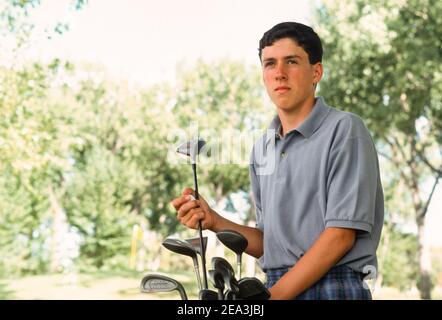 Teenager spielt gerne Golf, USA Stockfoto