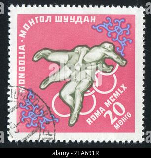 MONGOLEI - UM 1960: Stempel gedruckt von der Mongolei, zeigt Ringen, um 1960 Stockfoto